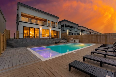 NEW Luxury Waterfront Home With Pool Sleeps 20