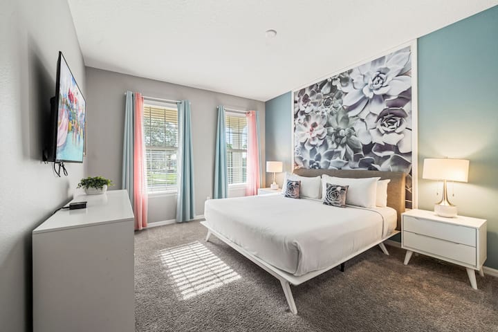 Dormitorio moderno 1 con una cama tamaño king