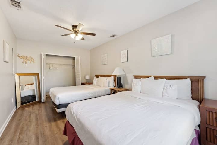 Bedroom with two queen beds. Perfect for families or groups needing flexible sleeping arrangements.