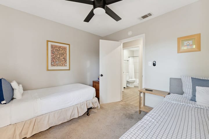 Bright and inviting bedroom with two twin beds.
