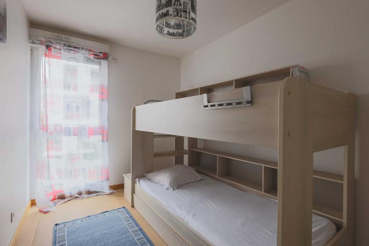 One bedroom with bunk bed and storage