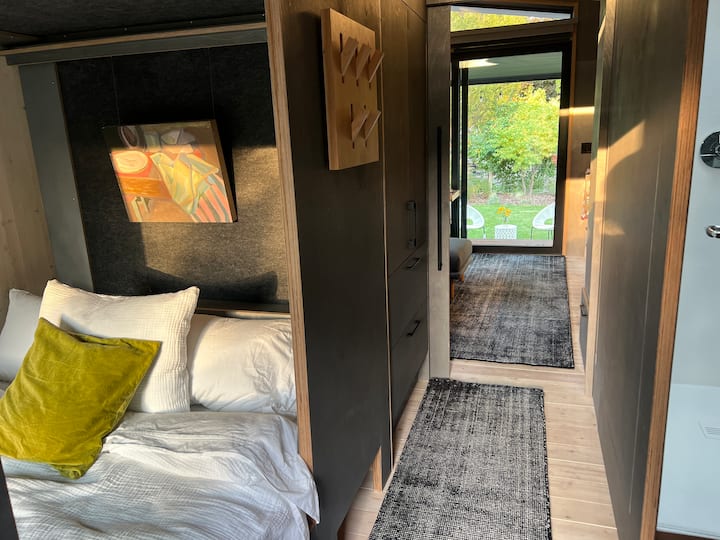 Comfortable, cozy yet spacious queen sized sleeping nook, with shelf, storage, usb at headboard