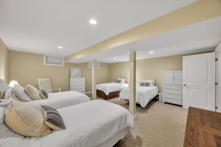 image 39 of 77, Another view of the lower-level bedroom shows thoughtful touches, ample lighting, and plenty of storage space.