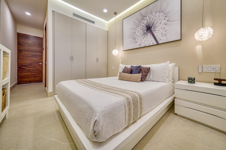 Elegant master suite with custom artwork and built-ins