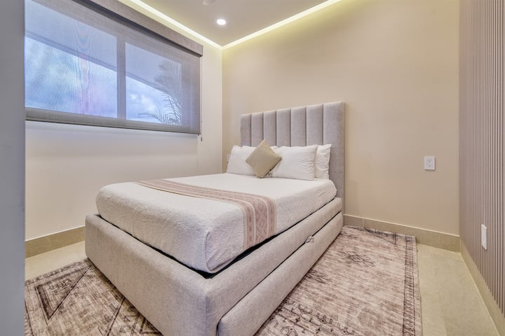 Extra bedroom with queen bed and clean, modern design
