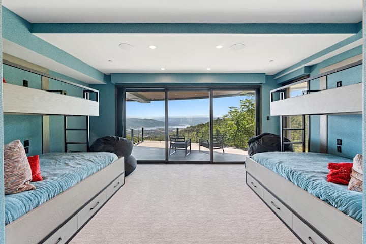 bunk suite with 4 beds and floor to ceiling windows