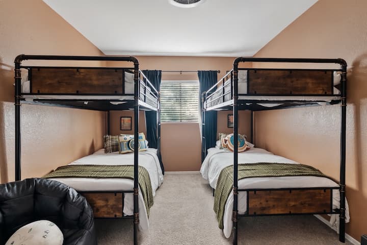 Bedroom 4:  This room is designed for fun and flexibility with two twin-over-twin bunk beds, perfect for kids, cousins, or friends to share.