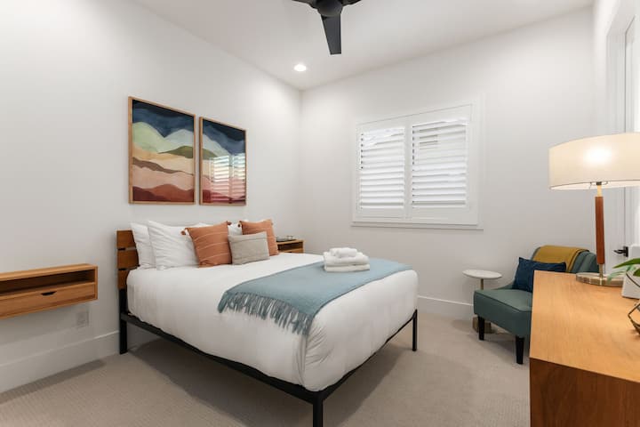 2nd Bedroom featuring a Queen bed, closet, and en-suite bathroom.