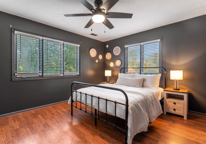 Bedroom 5, located on the upper level, features a queen bed.