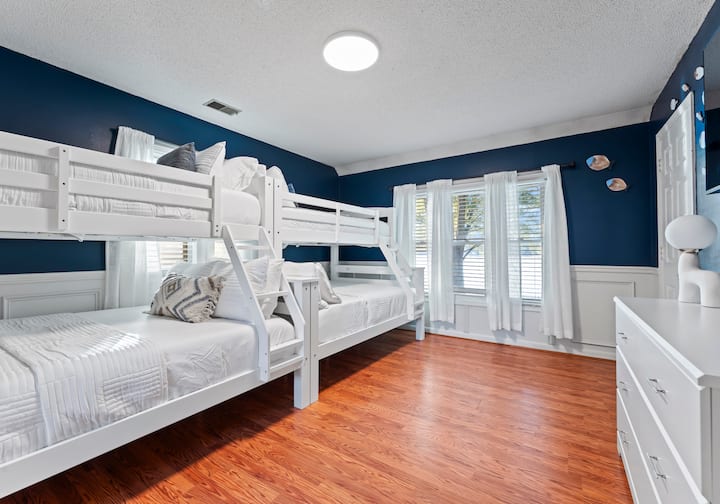 Bedroom 4, located on the upper level, features 2 twin-over-full bunk beds.