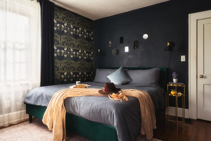 [Bedroom 2- Toby's Secret Garden] Plush beds and a cozy vibe give you all the vacation feels in this cozy bedroom downstairs.