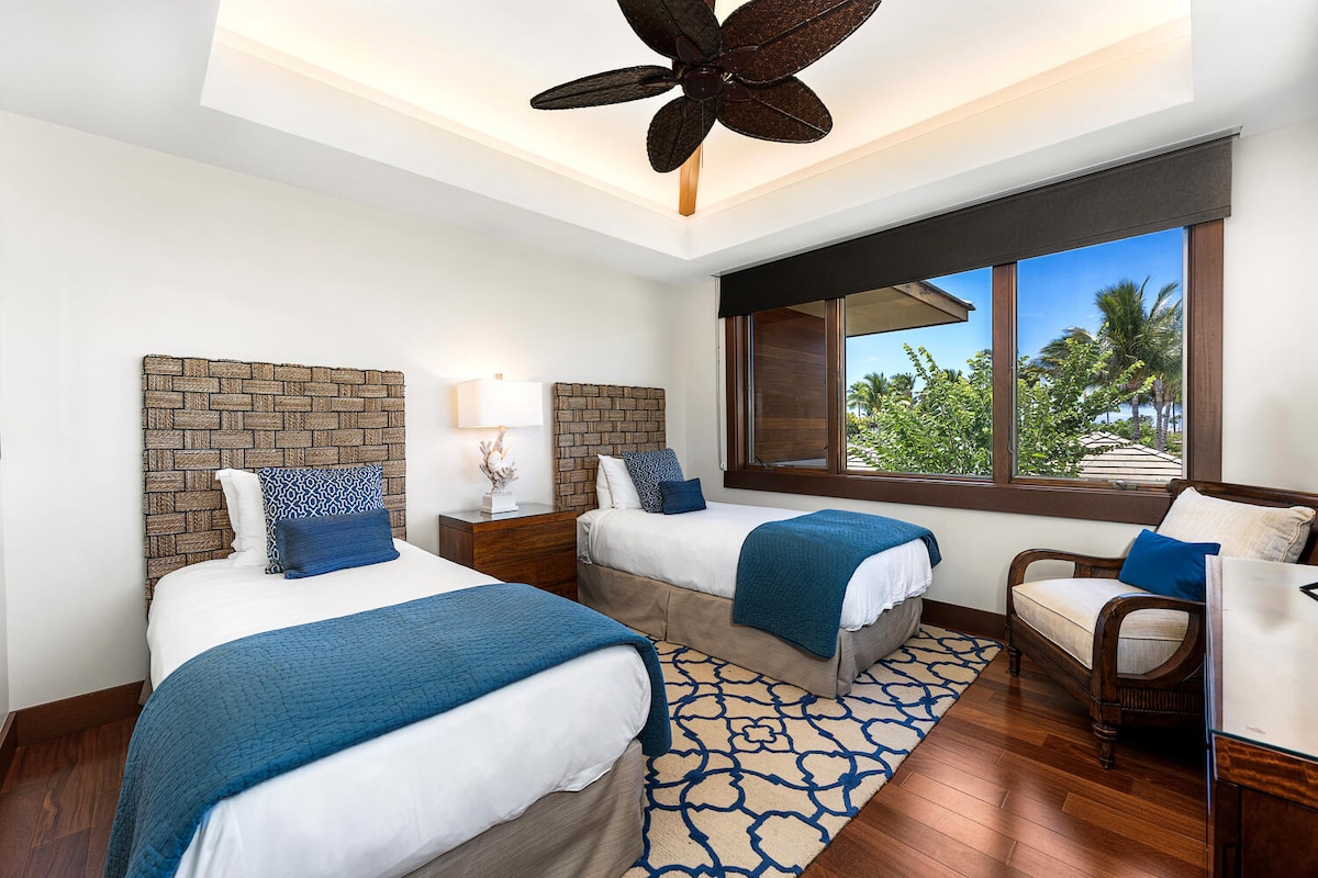 Twin guest suite with custom decor and mountain views from every bed at Laule'a #13.