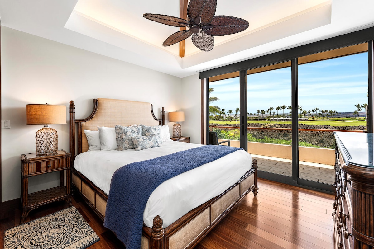 King guest suite with lanai access and rich hardwood floors at Laule'a #13.