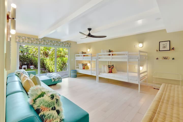 Bunk Room ( 1st Floor) | Four twin bunks, sectional, Smart TV, blackout blinds, private porch with dining table for 4, ensuite.