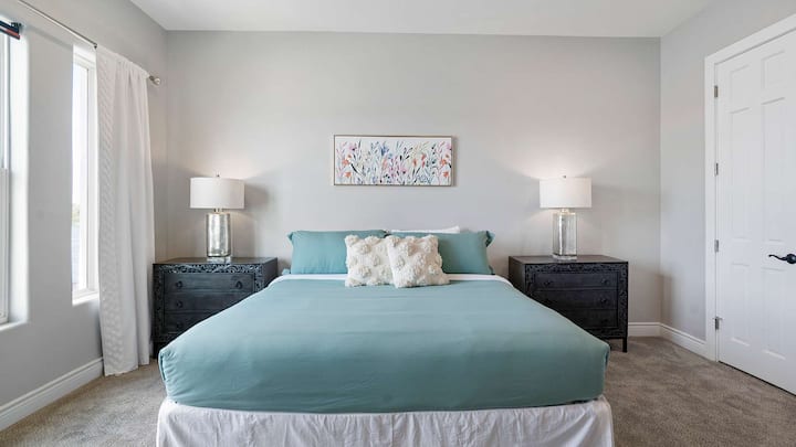 Bedroom 1: King-size bed & lake views!