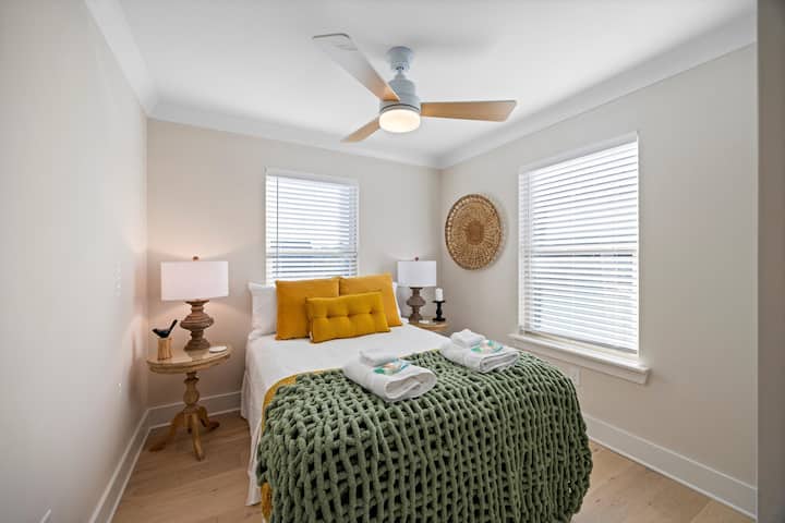 A cozy guest bedroom with woven wall accents