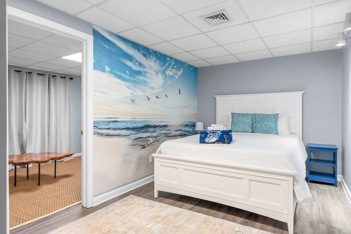 Bedroom #6 offers a queen-sized bed with fresh linens, creating a cozy and inviting retreat for couples or solo travelers.