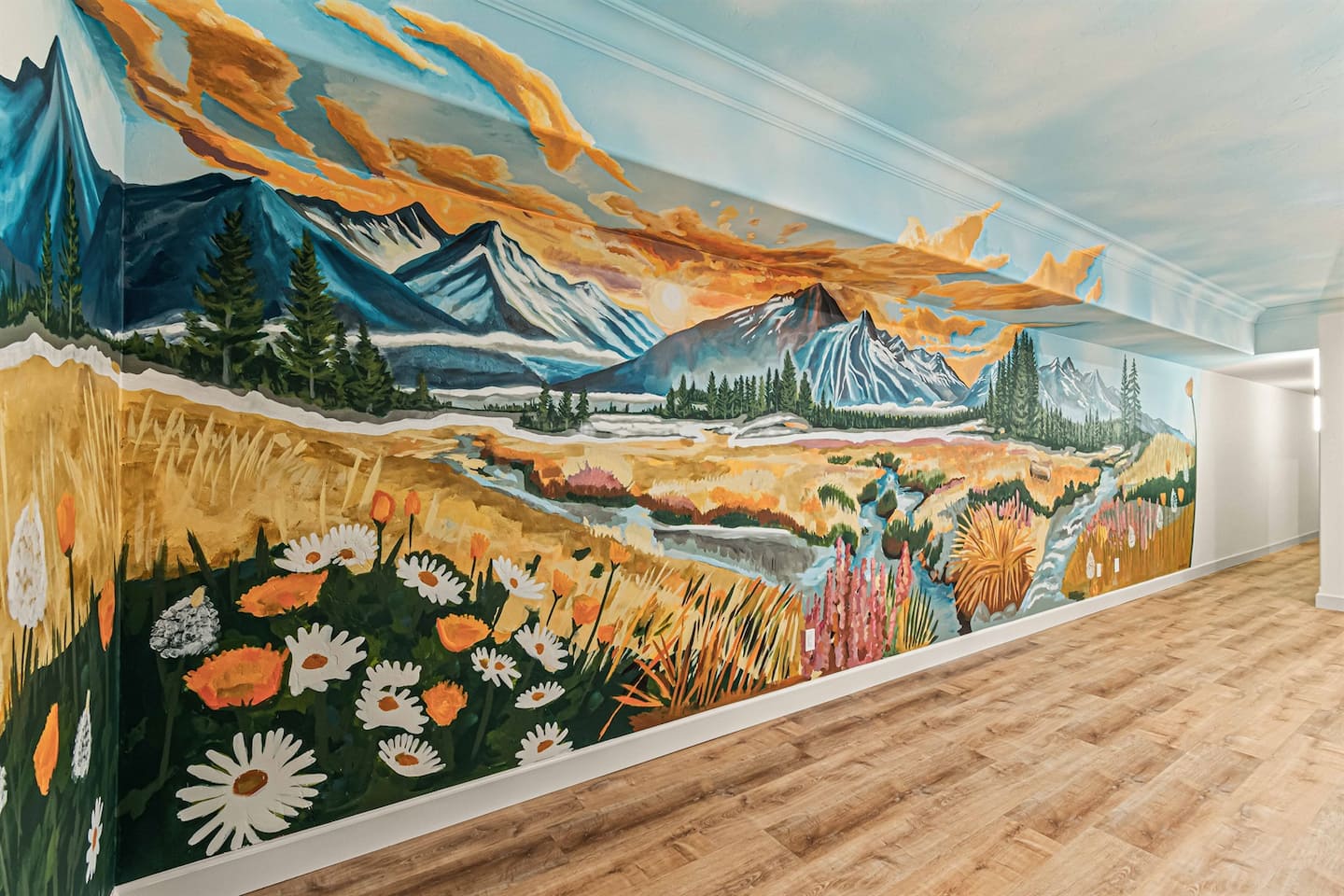 Hand-painted Montana mountain mural in the downstairs lounge at Soaring Eagle Lodge