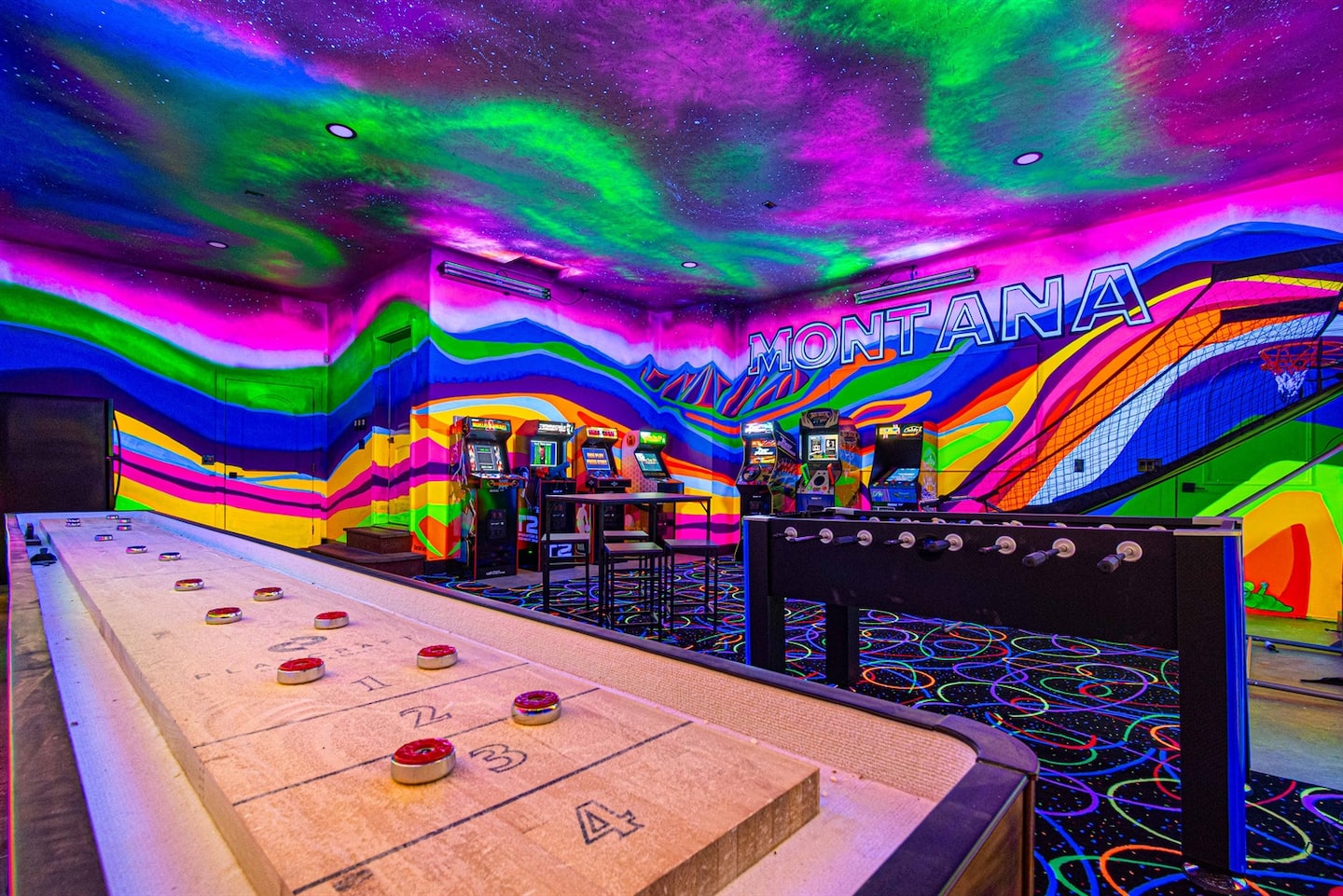 Custom glow-in-the-dark game room at Soaring Eagle Lodge