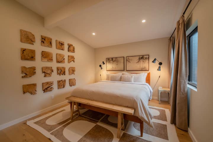 Third bedroom with a king-size bed, soft linens, and calming décor