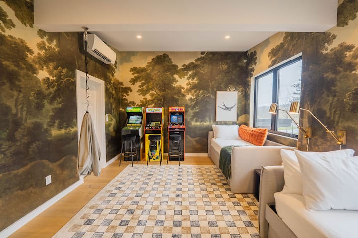 Upstairs room includes two twin beds w/trundles, vintage arcade games, smart TV, and a sensory swing