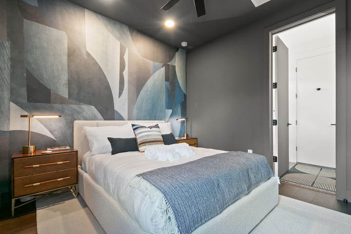 The master bathroom is shared between both bedrooms, allowing guests full access to its luxurious features. 