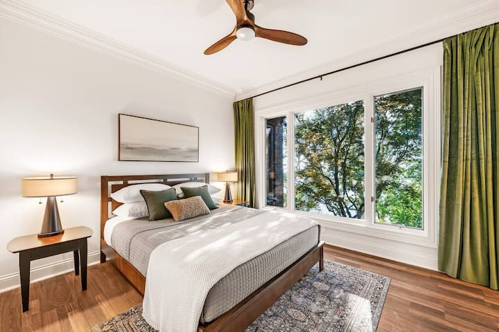 The Maple Room- Sweeping mountain views framed by a vibrant red maple. Private ensuite bath and 50 inch in room tilt TV. Where design meets mountain calm.