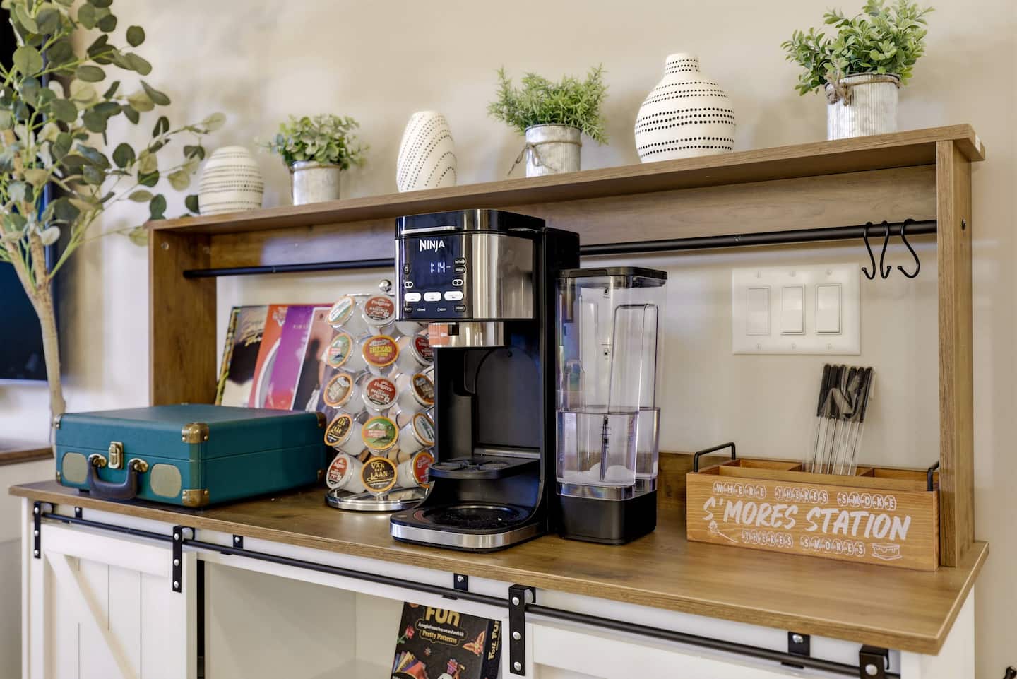 Chic coffee & s'mores station with K-cups and cozy decor