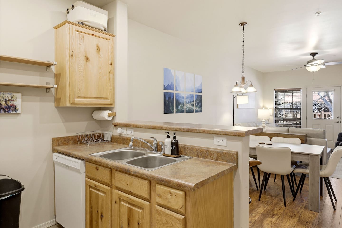 Sunny open kitchen with breakfast bar, dining nook, and inviting lounge