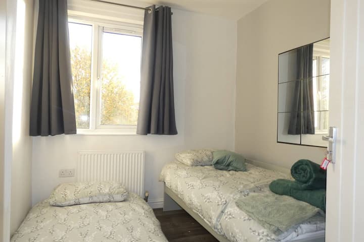 Bedroom with trundle bed (2x single beds), towels, smart TV with, and single wardrobe, 