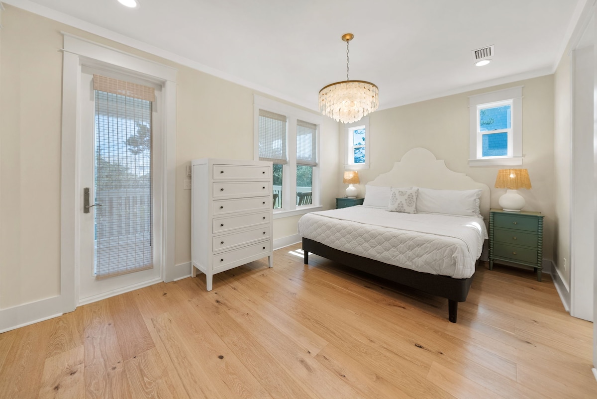 Bedroom #4 features king bed, with ensuite, access to covered porch, office space, & smart tv.