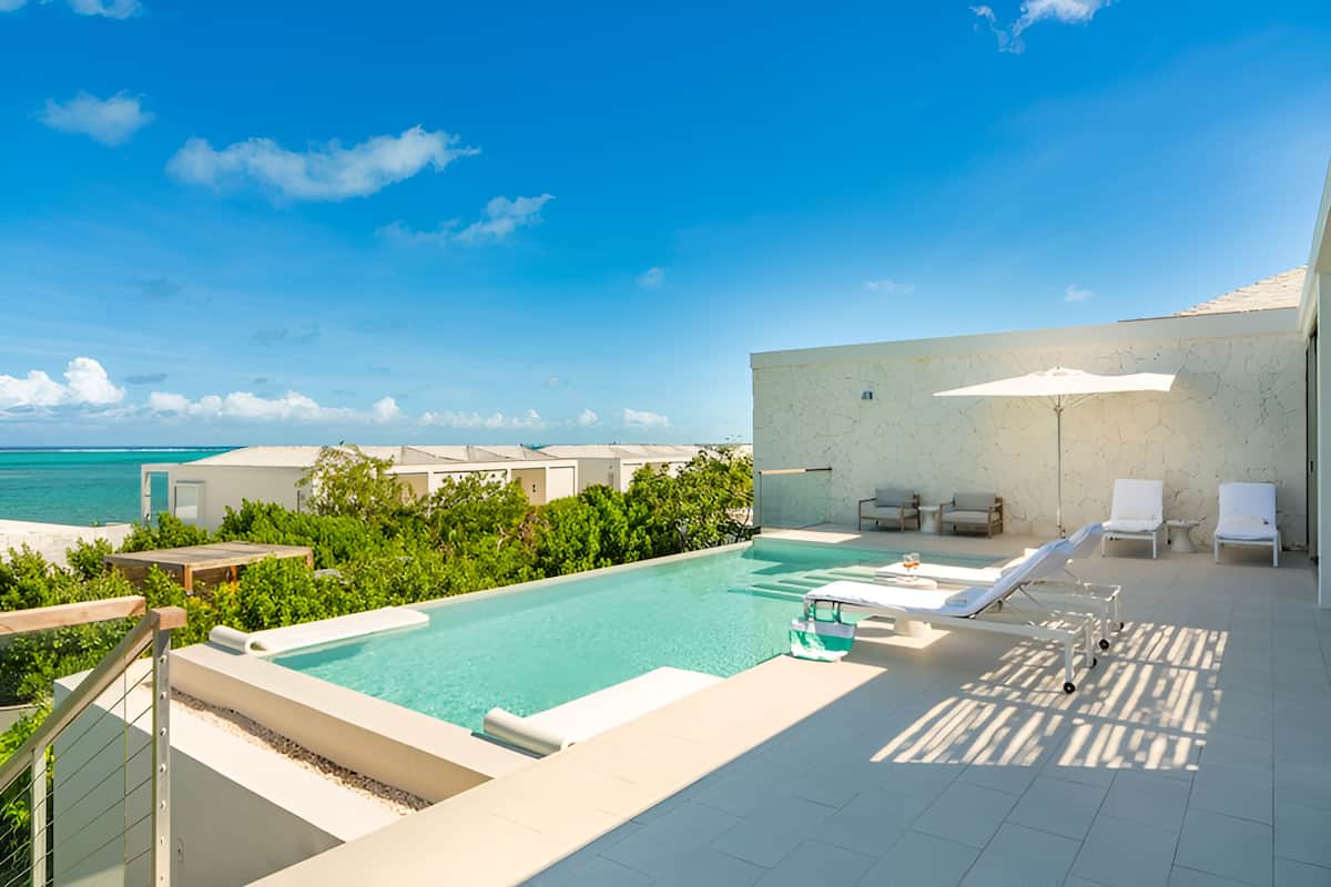 Serenity Awaits in a Modern Villa Steps from Beach