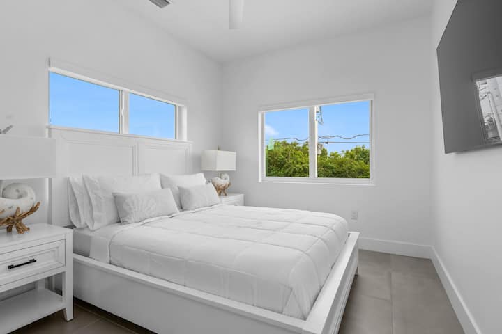 Cozy king room with natural light and relaxing vibes