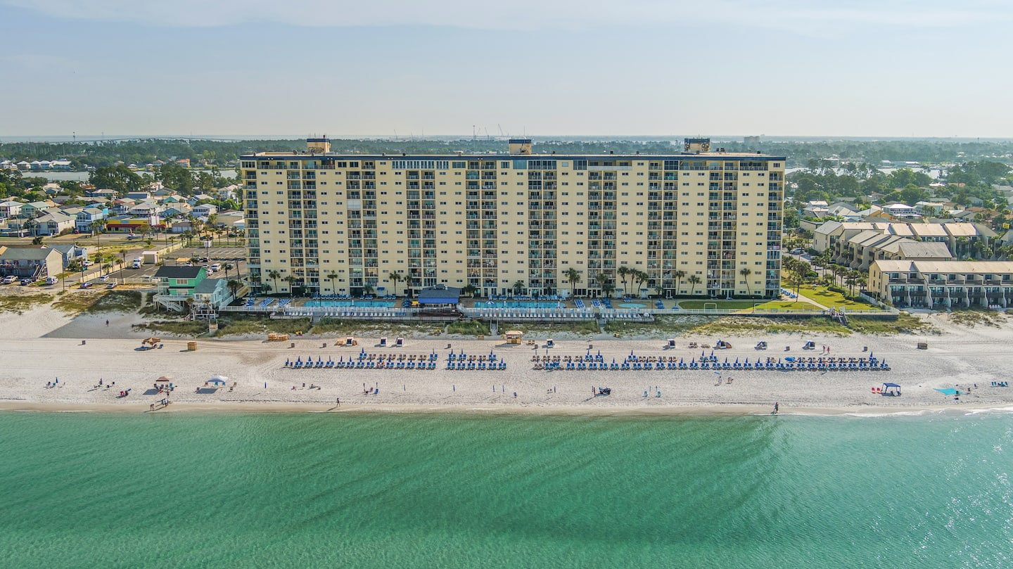 Aerial view of Regency Towers standing directly on the Gulf of Mexico