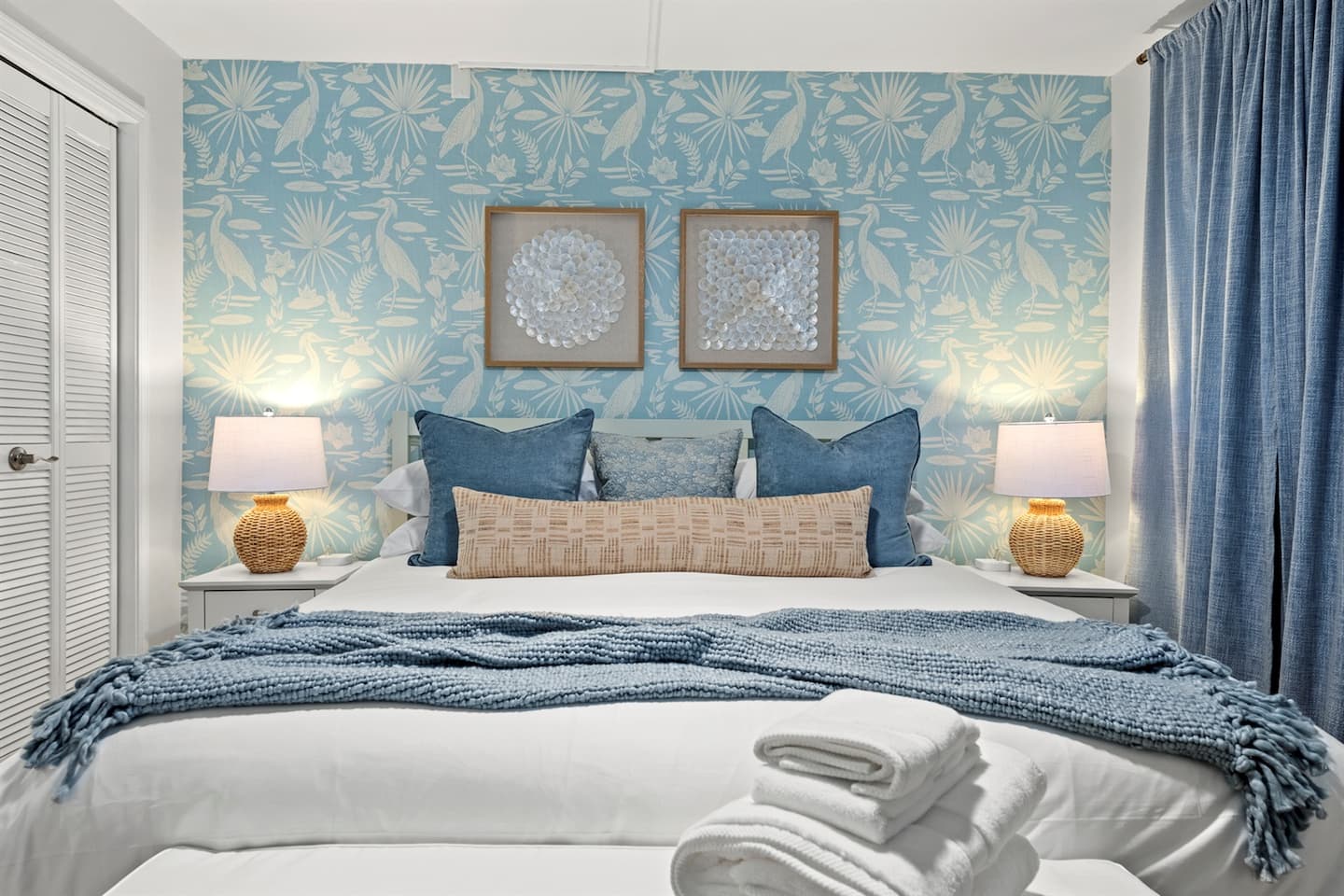 Bedroom two with a king bed and coastal blue decor