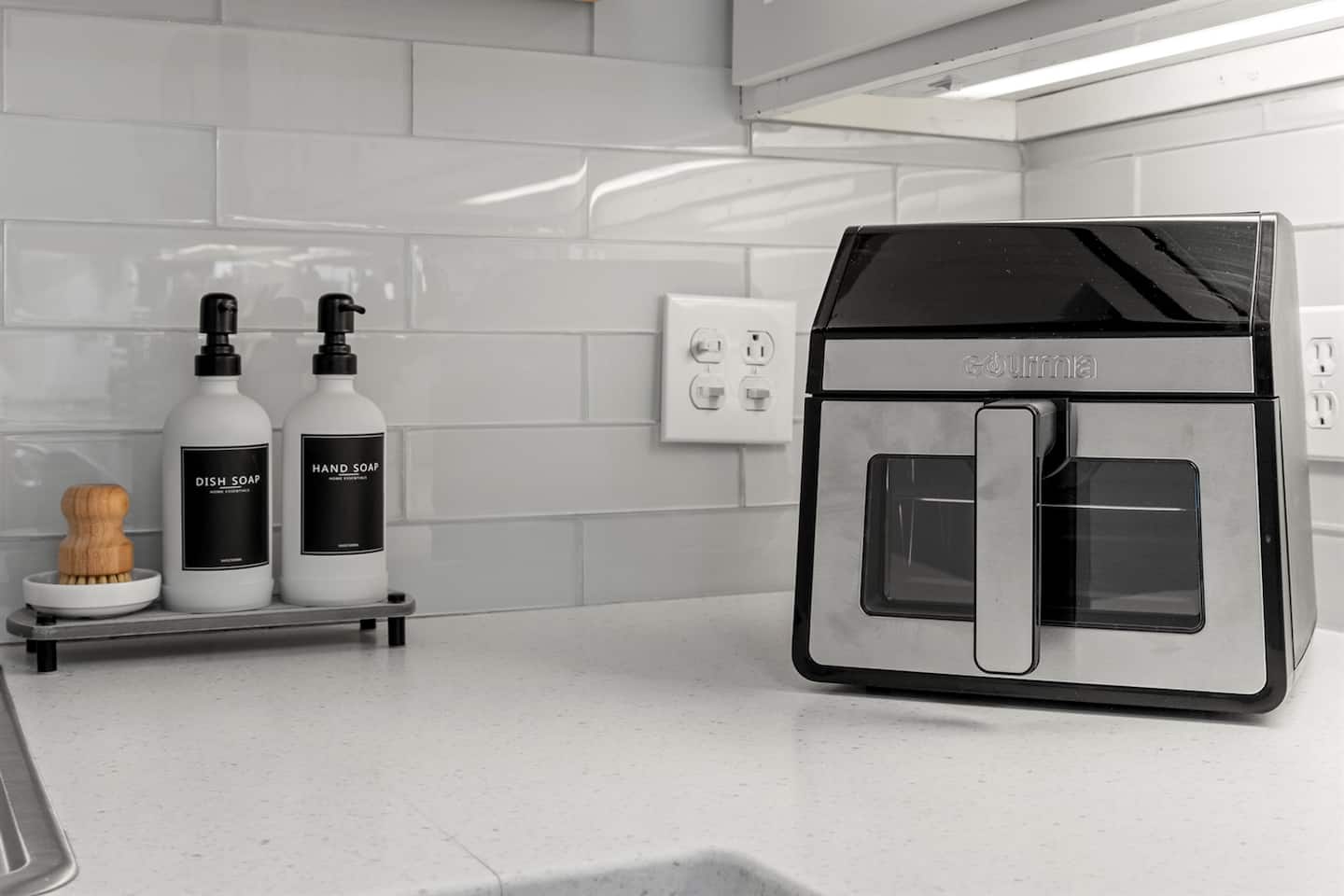 Guest-ready with sleek countertop essentials, offering both function and style for your daily routines.