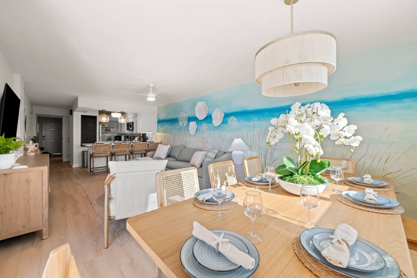 Bright, open space with dining, living, and kitchen areas flowing together for effortless morning to evening connection.