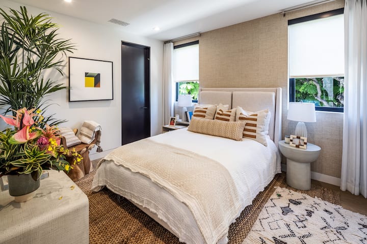 A warm, inviting bedroom with natural light and elegant touches designed for comfort and privacy.