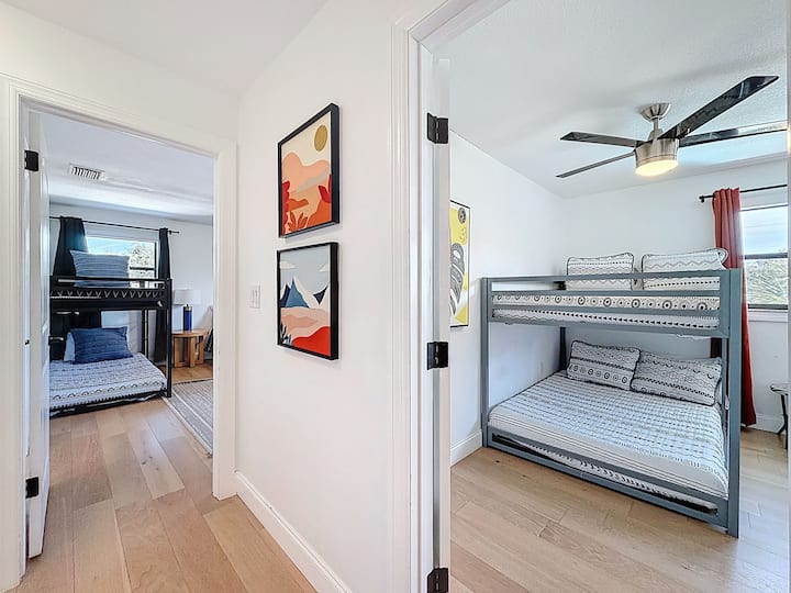 Looking into the Primary Bedroom (left), and Bedroom 5 on the right.