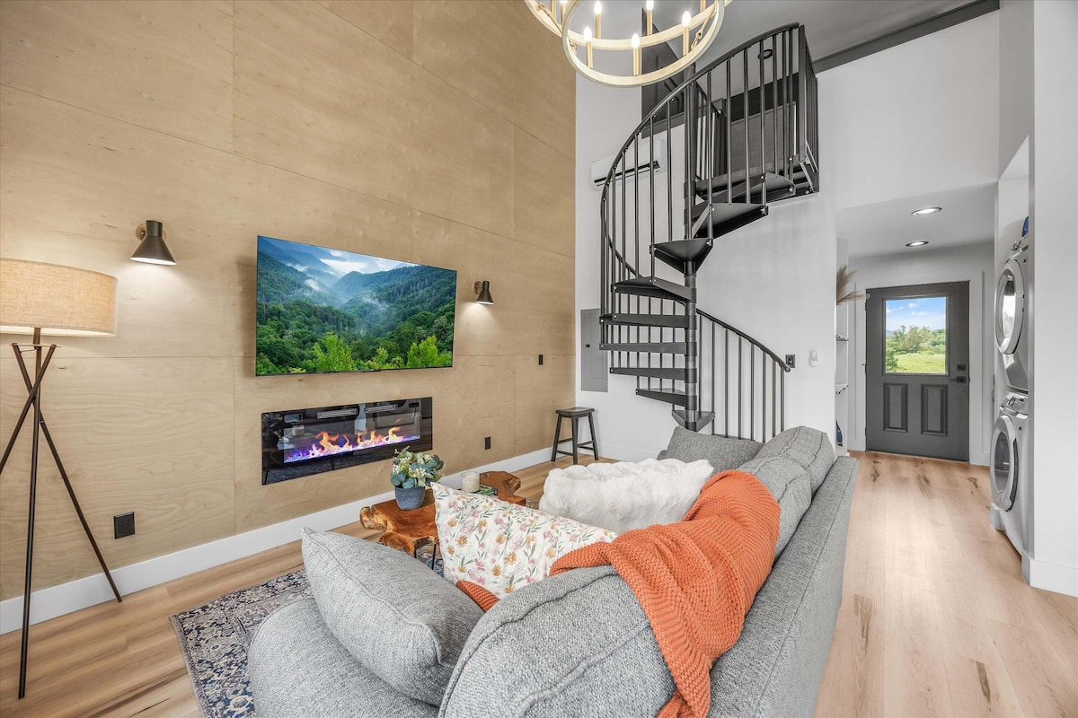 Living room with fireplace and spiral staircase
