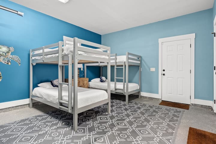 Bright bunk room sleeps 4 with beachy decor and spacious layout