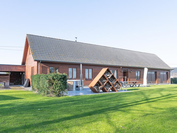 Luxury wooden house with spa bath and garden