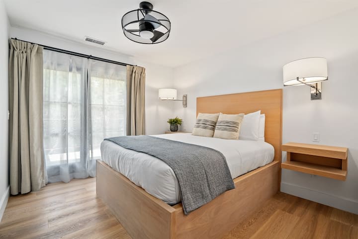 A sophisticated retreat with an expansive Olympic Queen bed, a private bath, and an exceptionally puffy mattress.