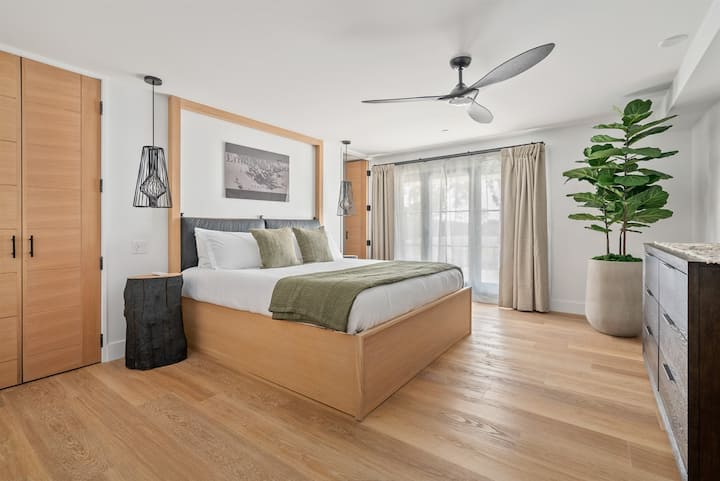 A stylish king bedroom offering space, comfort, and a soothing atmosphere for your stay.