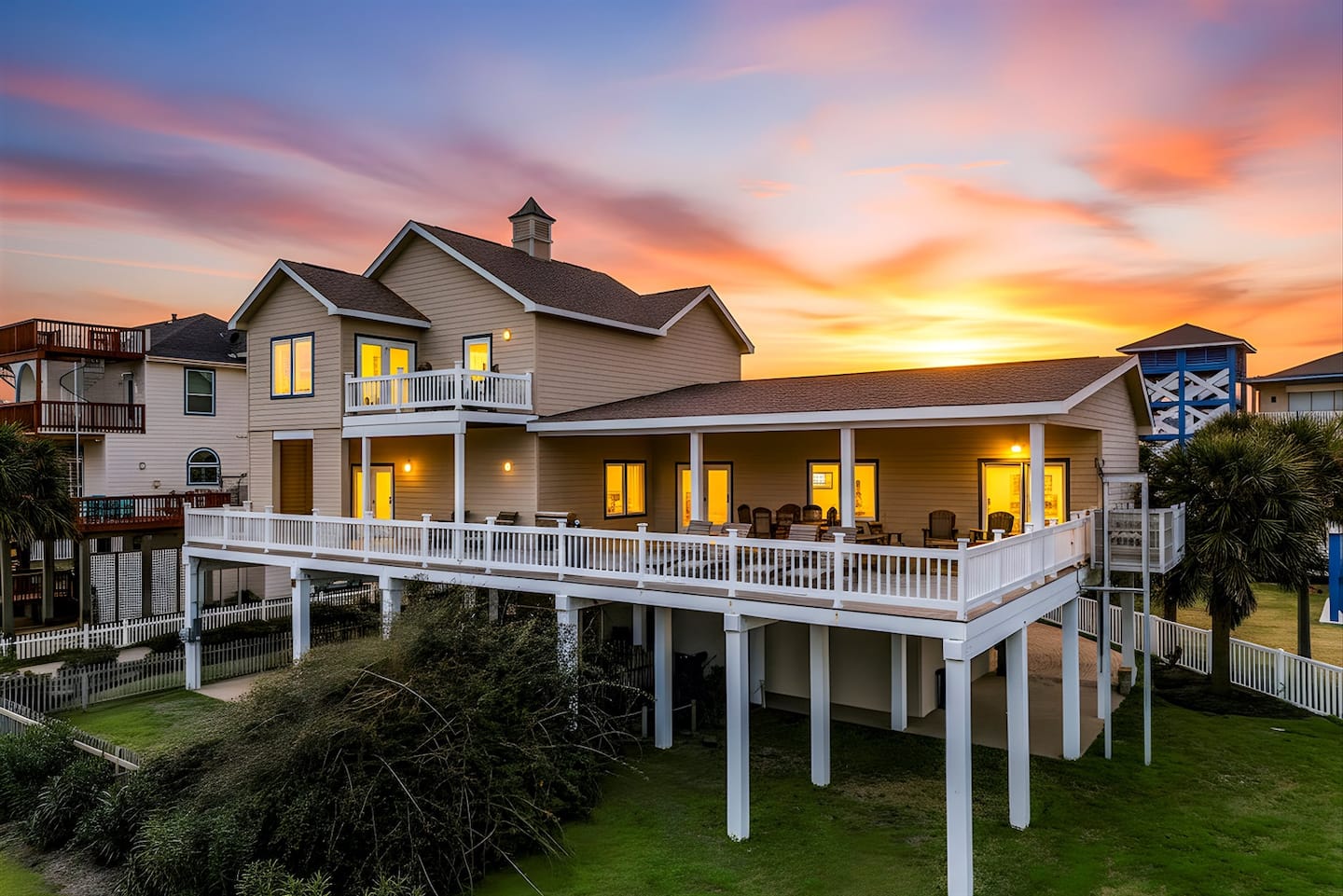 Exterior view of the multi-level beach house from the driveway