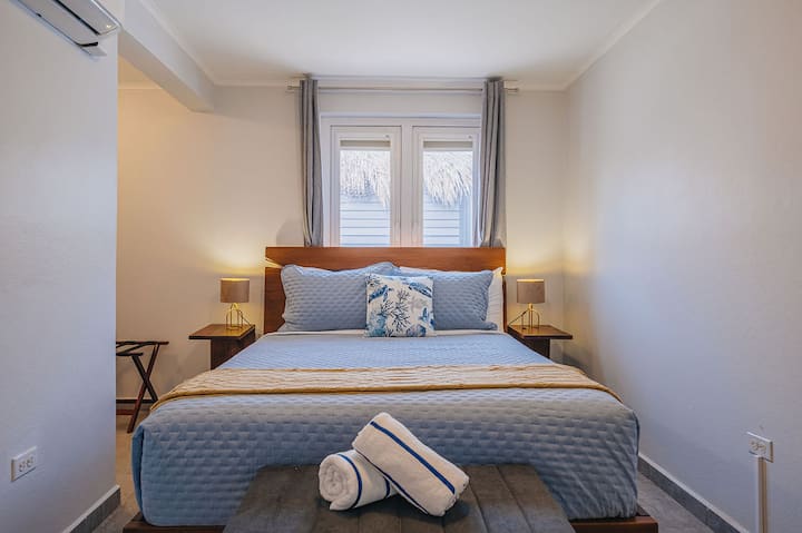 Bedroom 4 with a cozy queen bed and a calm, restful atmosphere.