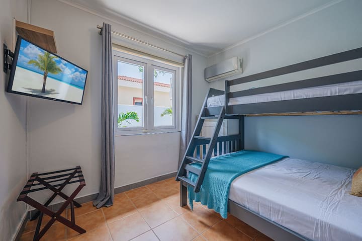 Bedroom #2 with a full bed and single bunk, perfect for families.