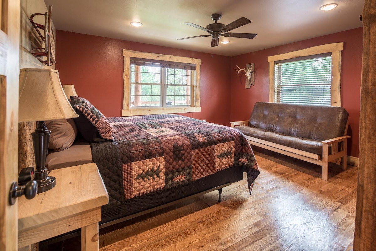 Main floor bedroom with king size bed and full size futon.