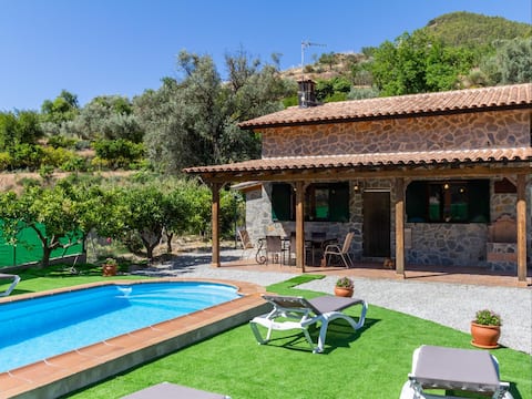 Charming farmhouse among orange trees