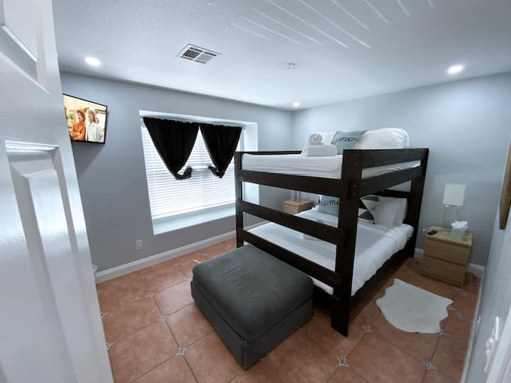 Bedroom 4(upstairs) Bright and inviting with a queen bunk bed, dresser, and plenty of space for the whole crew to settle in.